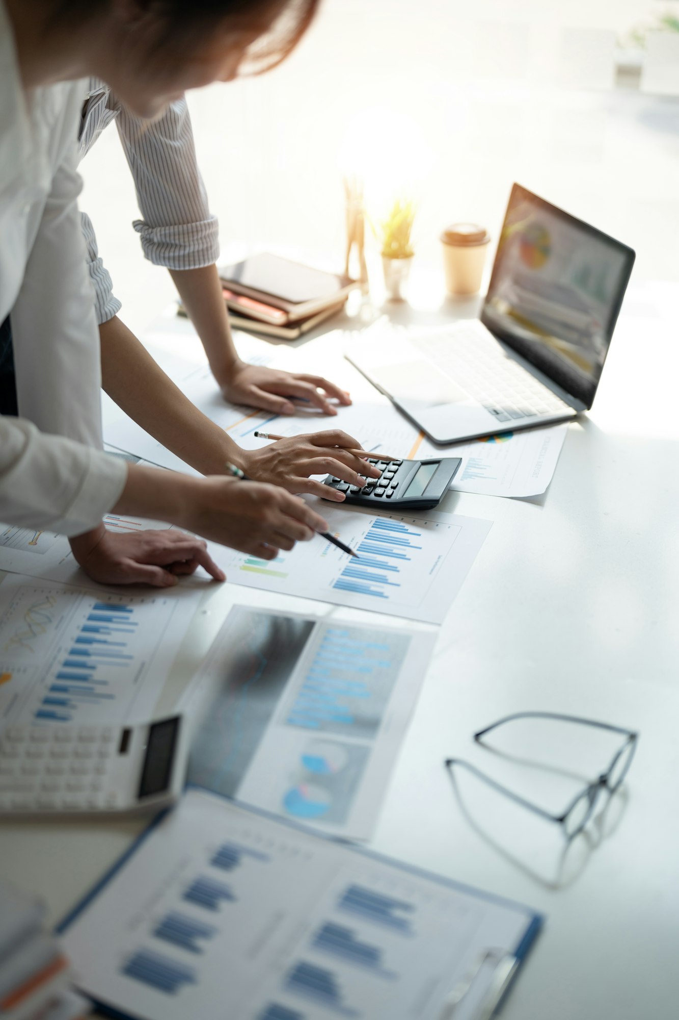 Business people are meeting discussion for analysis data figures to plan business strategies Business people are meeting discussion for analysis data figures to plan business strategies