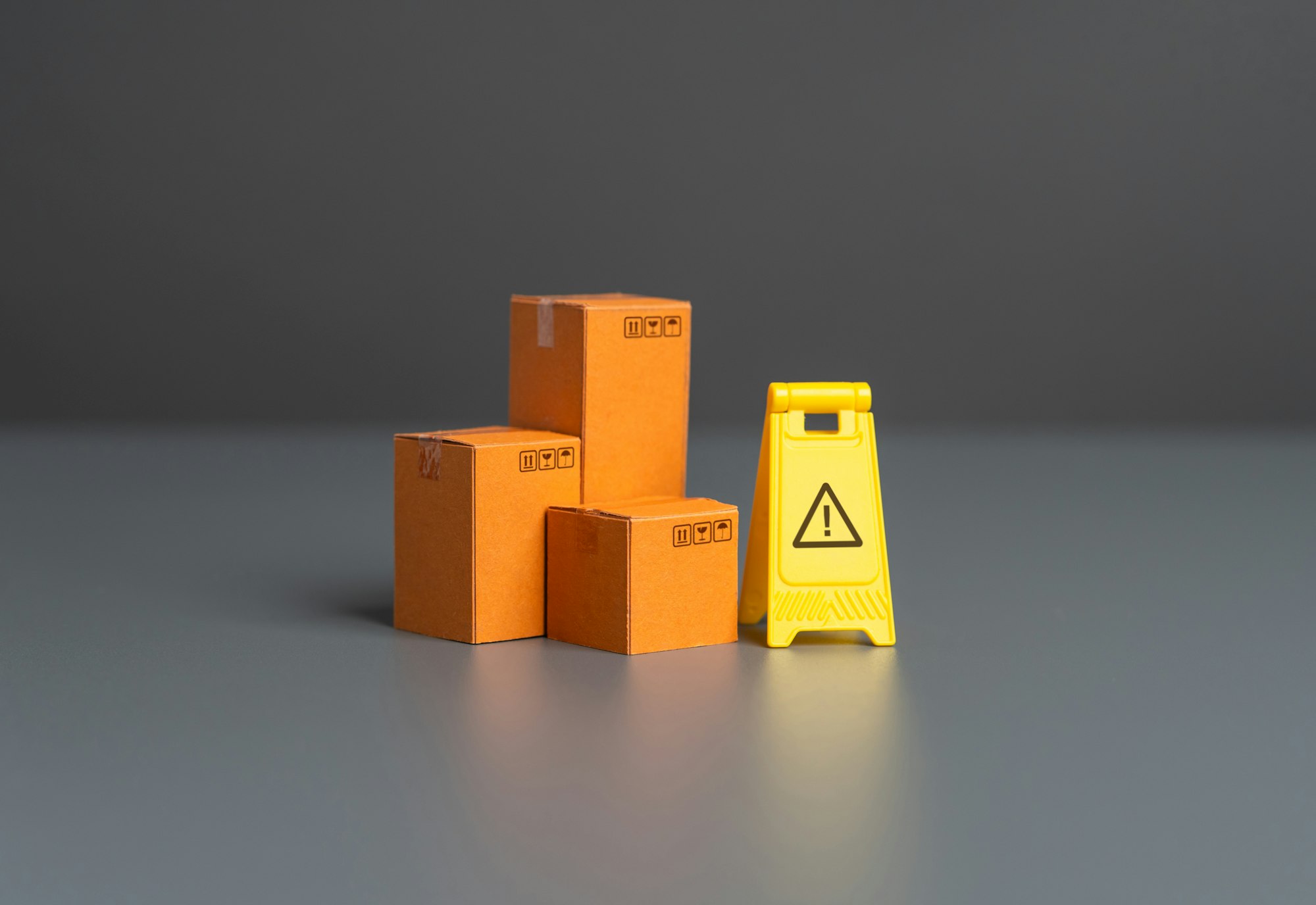 Boxes and warning sign. Restrictions on trade, import and export of goods. Boxes and warning sign. Restrictions on trade, import and export of goods.